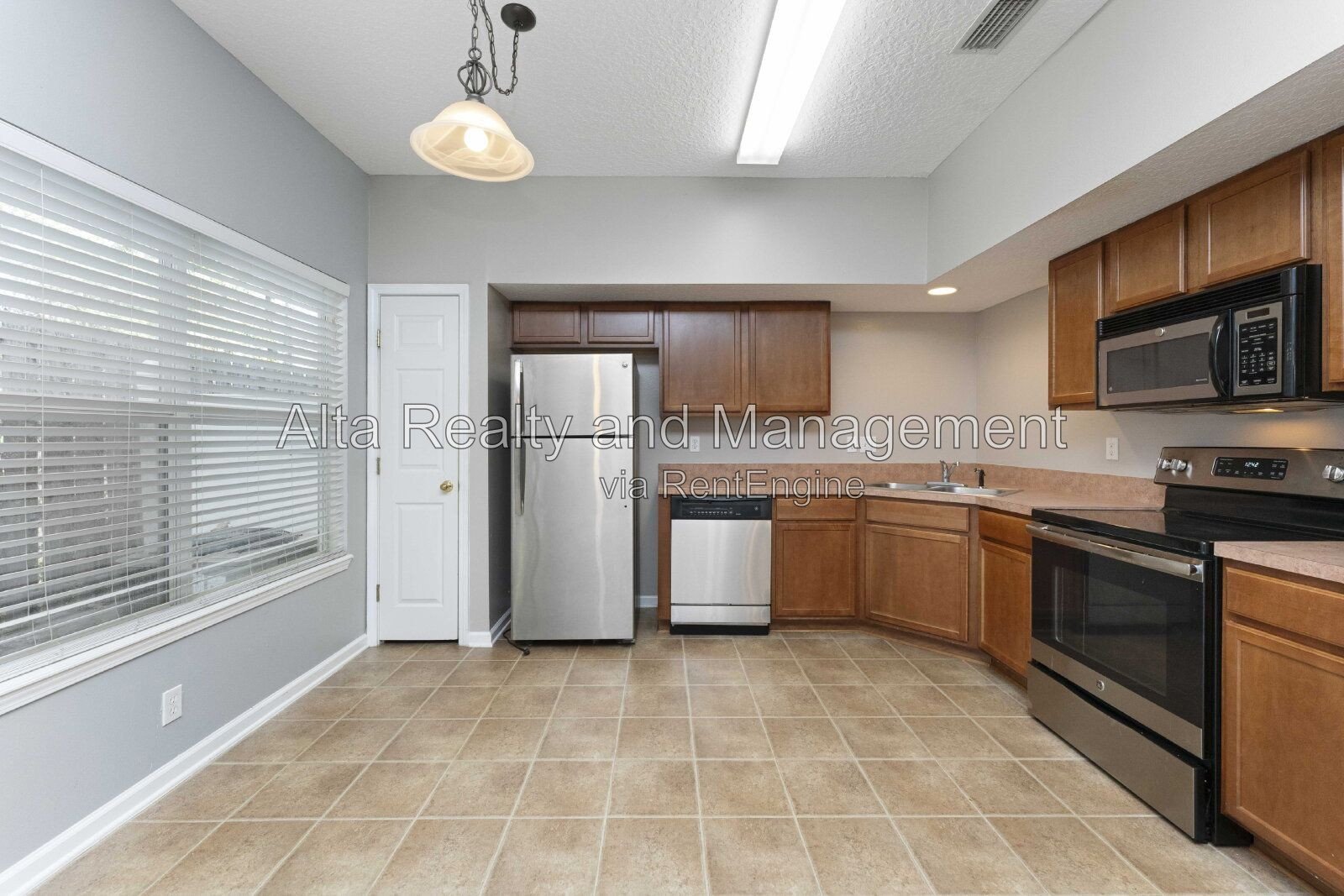 Charming 3BR Townhouse with Garage & Private Patio – Prime Location Near NAS JAX property image