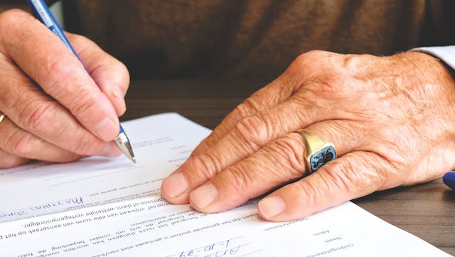 person signing papers